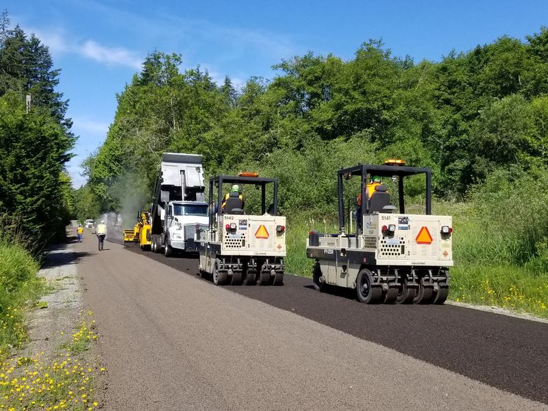 Asphalt paving and sealcoating crew working near Davenport